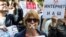 Russia -- A protester with tape covering her mouth takes part in the March for Free Internet in central Moscow, July 23, 2017