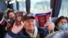 Получившие российские паспорта жители Донецка в автобусе по дороге в Ростовскую область, где они принимали участие в голосовании на выборах в Госдуму